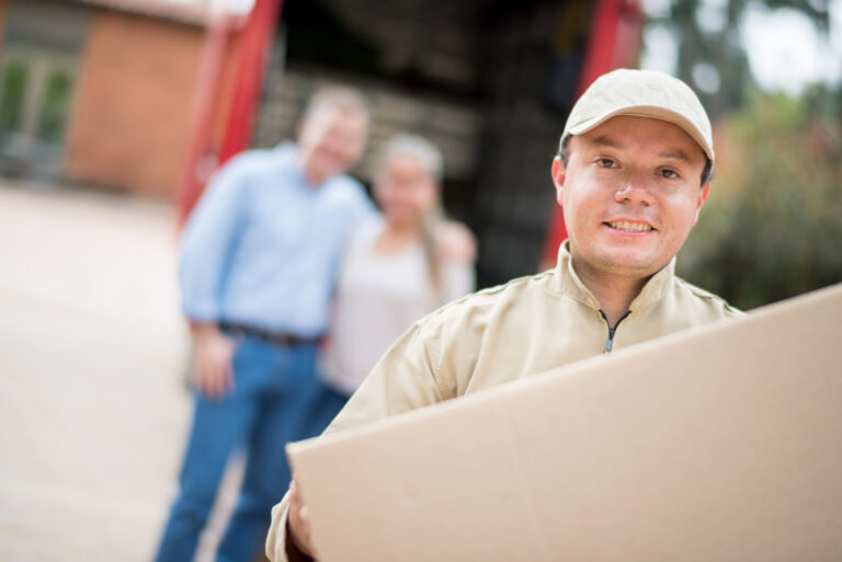 Mover helping couple moving house