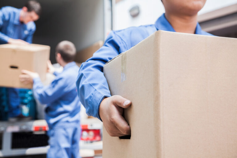 Movers unloading a moving van